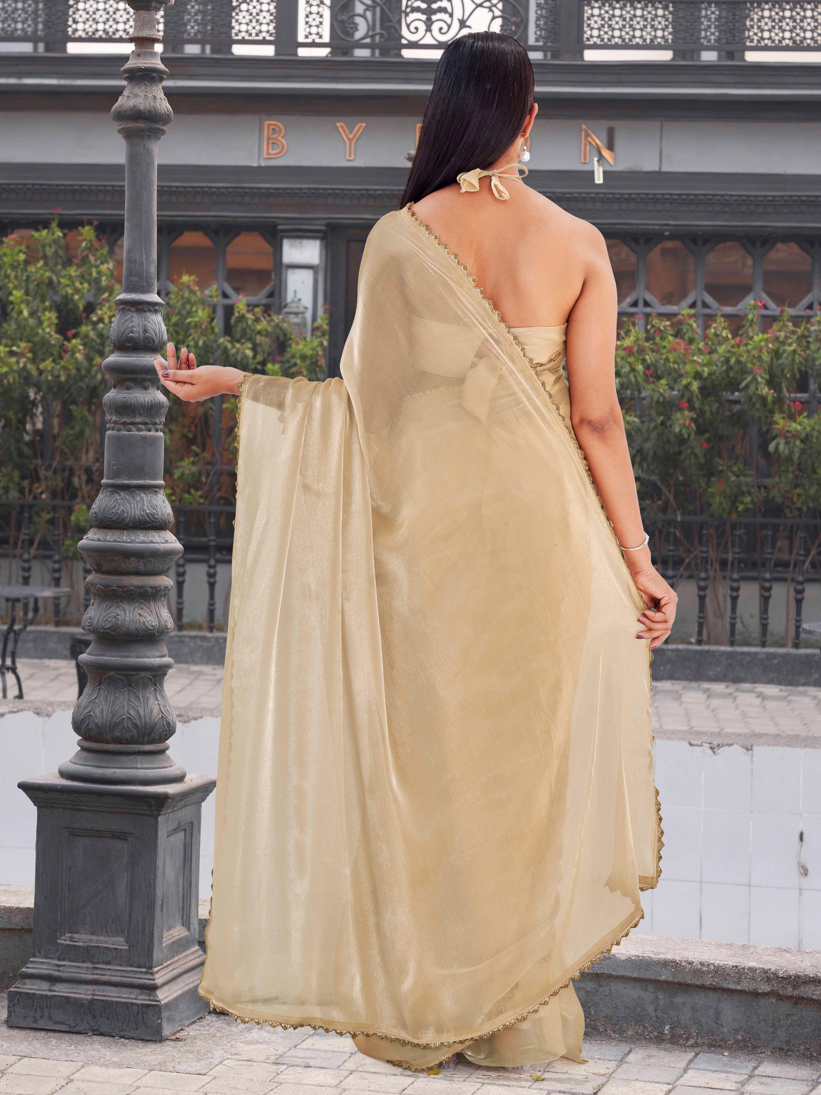 Beige colored jimy cho saree with handwork border